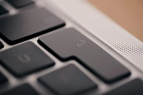 Close up shot of Enter button of an apple brand macbook. Stock Photos