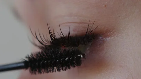 Close up shot of eye opening with beautiful blue iris. Macro girl paints her Stock Footage 237466383