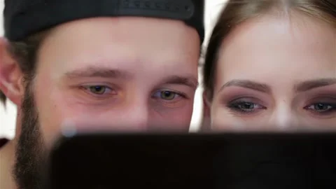 Close-shot eyes couple using a tablet Stock Footage 252598582