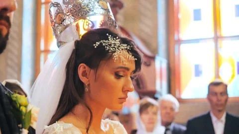 Close-up shot of the face of a beautiful bride in a luxurious white dress at a Stock Footage 126200155