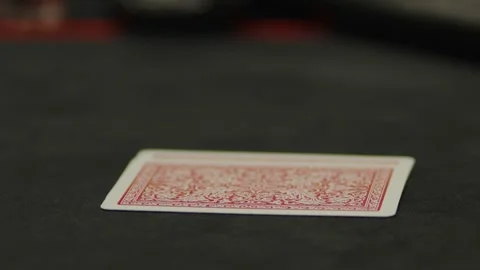 A close-up shot of a face-down playing card on table Stock Footage 336238889