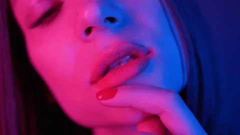 Close-up shot of face of stunning young woman biting lips. Trendy make-up Stock Footage 119547326
