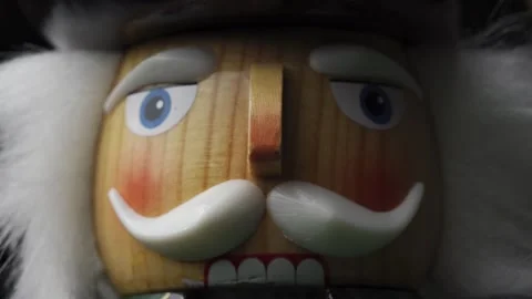 A close-up shot of the face of a wooden nutcracker doll featuring intricate.. Stock Footage 337388344