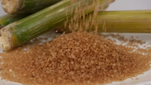 Close shot of falling sugar over white table Stock Footage 148220864