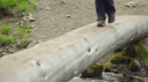 Close up shot of feet crossing log Stock Footage 59084811