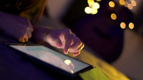 Close up shot of female hand using tablet and touching slide on screen. Stock-Footage 205437397