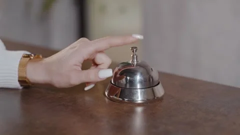 Close-up shot of female hands ring the bell at the reception Video stock 240301008