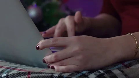 Close up shot with female hands using laptop touchpad. Chrismas three on BG 스톡 동영상 82346004