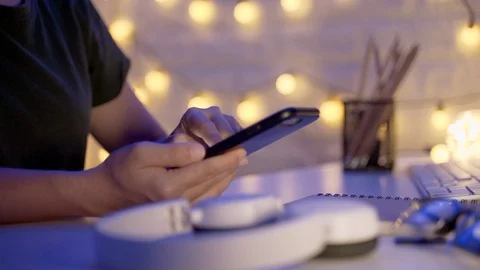 Close up shot of Female hands using smart phone in office at night Video stock 124628554