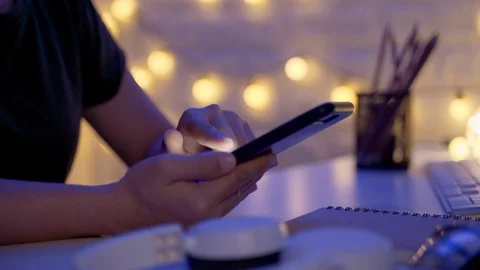 Close up shot of Female hands using smart phone in office at night Stock-Footage 124628685