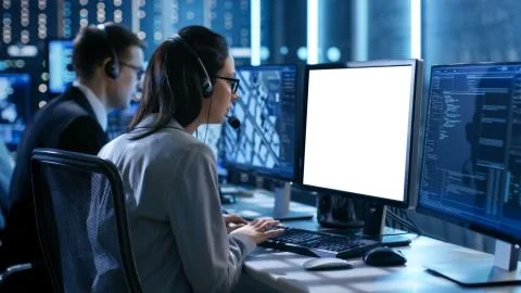 Close up Shot of Female working in a Technical Support Team Gives Instruction Foto stock