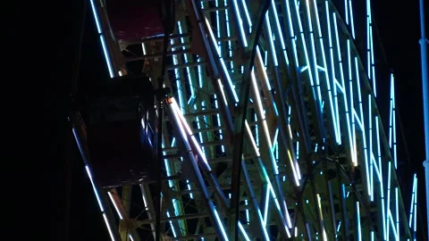 Close up shot of ferris wheel at night. Colorful led neon light decoration. Video stock 279364292