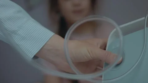 Close up shot of finger pressing button to start the nebulizer working. Medical Stock Footage 253104710
