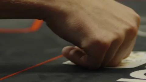 A close-up shot of fingers touching community cards on table Stock Footage 336237717