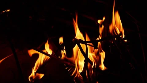 Close shot of fire flames due to burning woods, Burning woods close view Vídeo Stock 148210493