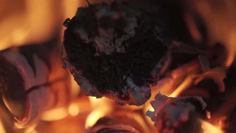 Close up shot of flames burning  through wood fire logs 動画素材 150895876