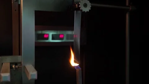 Close up shot on flammability test on plastic material Stock Footage 82195506