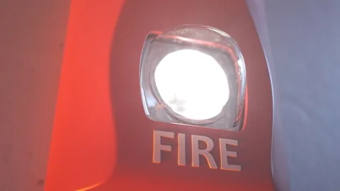 "Close up shot of flashing strobe red fire alarm during fire in the room." Stock Footage 97462766
