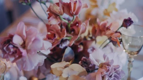 Close up shot of floristic beautiful composition on wedding party banquet table Stock Footage 98756436