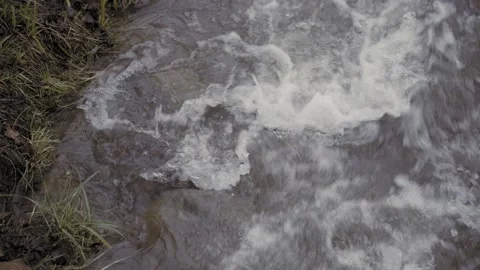 Close-Up Shot Of A Foaming, Rushing Creek Vortex Stock Footage