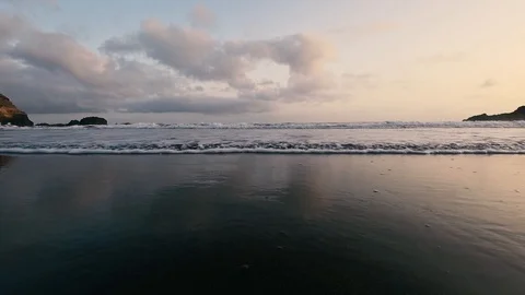Close up shot of foamy waves on coast and clouds in the sky Stock Footage 116471309