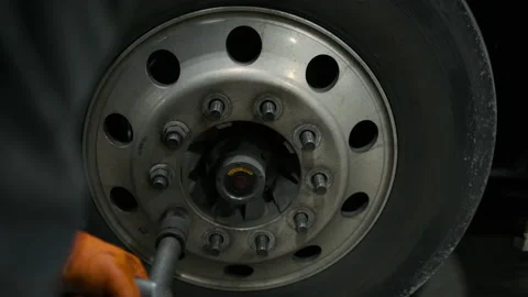 Close up shot footage of Worker makes repair wrench wheel tire truck closeup Stock Footage 220362948
