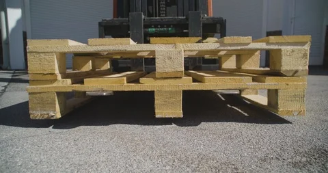 Close up shot, forklift driver lifting empty pallet, 4K. Stock Footage 117190655