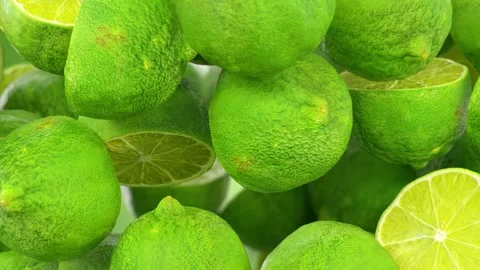 Close-up shot of fresh limes, both whole and sliced,  Stock-Footage 282913351