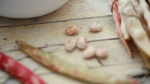 Close up shot of  fresh raw  kidney bean pods on table. Stock Footage 93700863