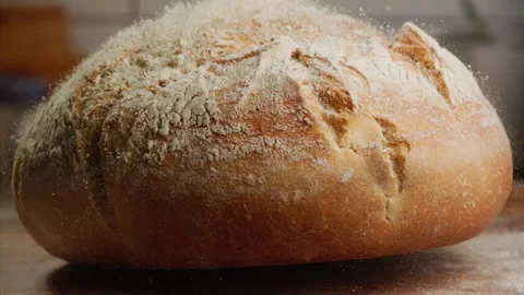 Close up shot of freshly baked bread falling in slow motion Stock Footage 153465798