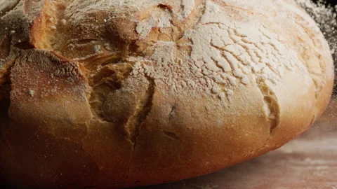 Close up shot of freshly baked bread falling in slow motion Stock Footage 153465885