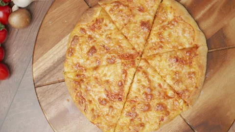 Close-up shot of a freshly baked New-York cheese Pizza in slow motion in 4K. Stock Footage 137480853