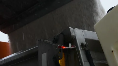 Close Up Shot, Front End Loader Truck Dumping Road Salt Into Snow Plow Stock Footage 148703748