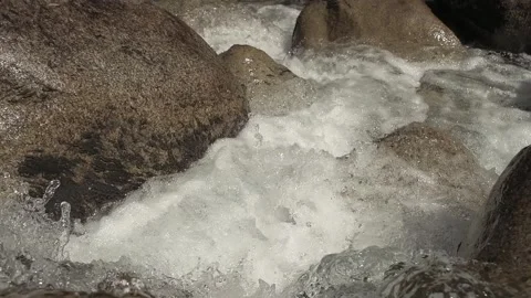 Close-up shot of a full-flowing mountain river. Stock Footage 327169093
