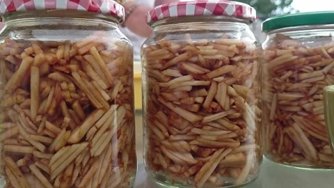 Close Up Shot of Glass Jars Packed with Grated Apples for Baking Cakes Stock Footage 345670277