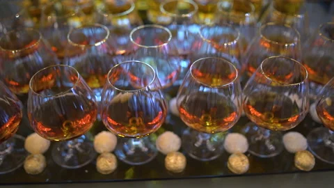 Close shot of glasses with drinks. Set of beverages and sweets at the party Stock Footage 148737114
