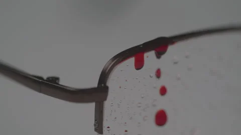 Close up shot of Glasses placed on table with Blood Stain dripping down indoors Stock Footage 208804853