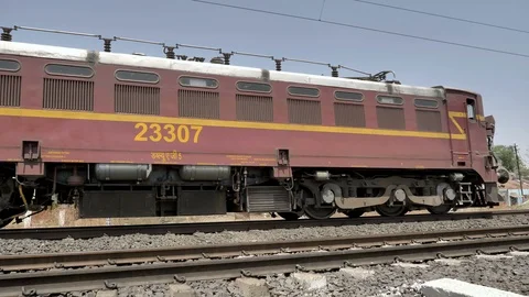 Close shot of goods or freight Indian train passing with two engines Stock Footage 109249180