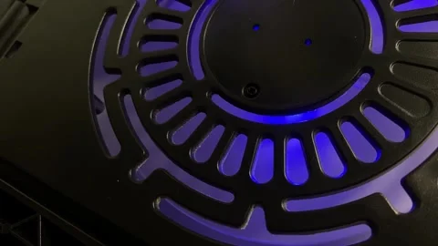 A close-up shot of the gray plastic blades of a cooling fan inside a laptop.. Stock Footage 323215385