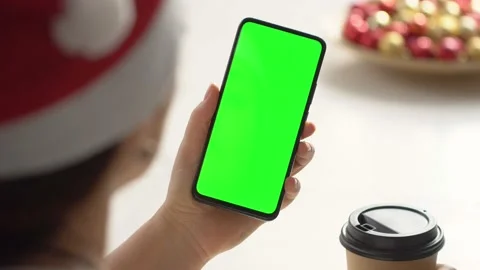 Close-up shot of green screen template smartphone in female hands at home offise Video stock 143589207