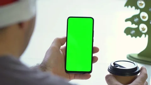 Close-up shot of green screen template smartphone in male hands at home offise Video stock 143589366