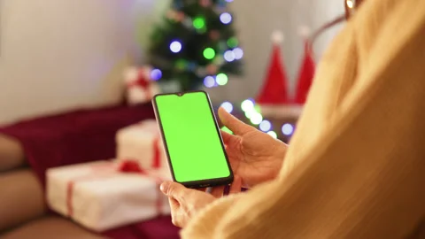Close-up shot of green screen template smartphone in female hands Video stock 164597992