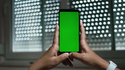 Close-up Shot of Green Screen Template Smartphone in Office. Watcing Content Stock Footage 194693465