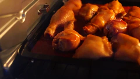 Close-up shot Grilling bbq barbecue chicken in the hot oven. Selective Focus	 Stock Footage 133993115