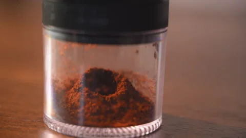 Close up shot of the ground coffee in the container of Coffee grinder machine Stock-Footage 314763544