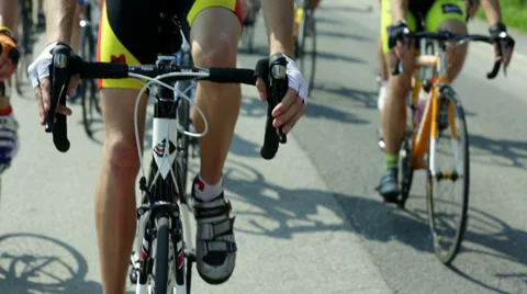 Close shot of a group of leading competetive cycling racers Stock Footage 32456479