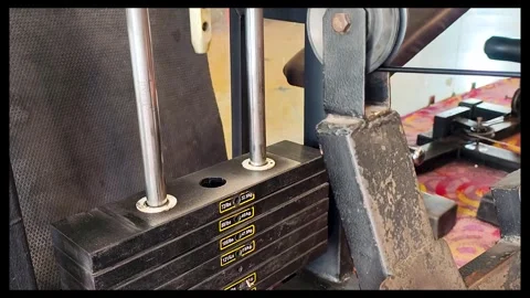 Close-Up Shot of Gym Weight Machine During Workout Stock Footage 327870326