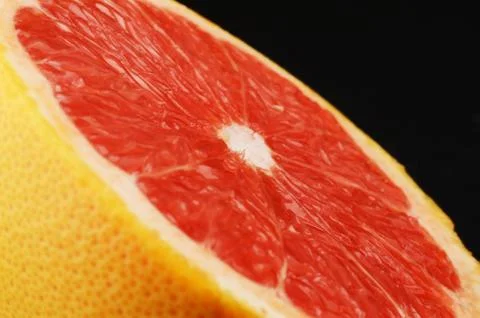 Close up shot of half of grapefruit on white background Stock Photos