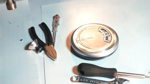 A close-up shot of a hammer hitting a disc player. Stock Footage 123912072