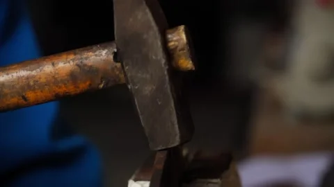 Close up shot of a hammer hitting metal Stock Footage 314736380
